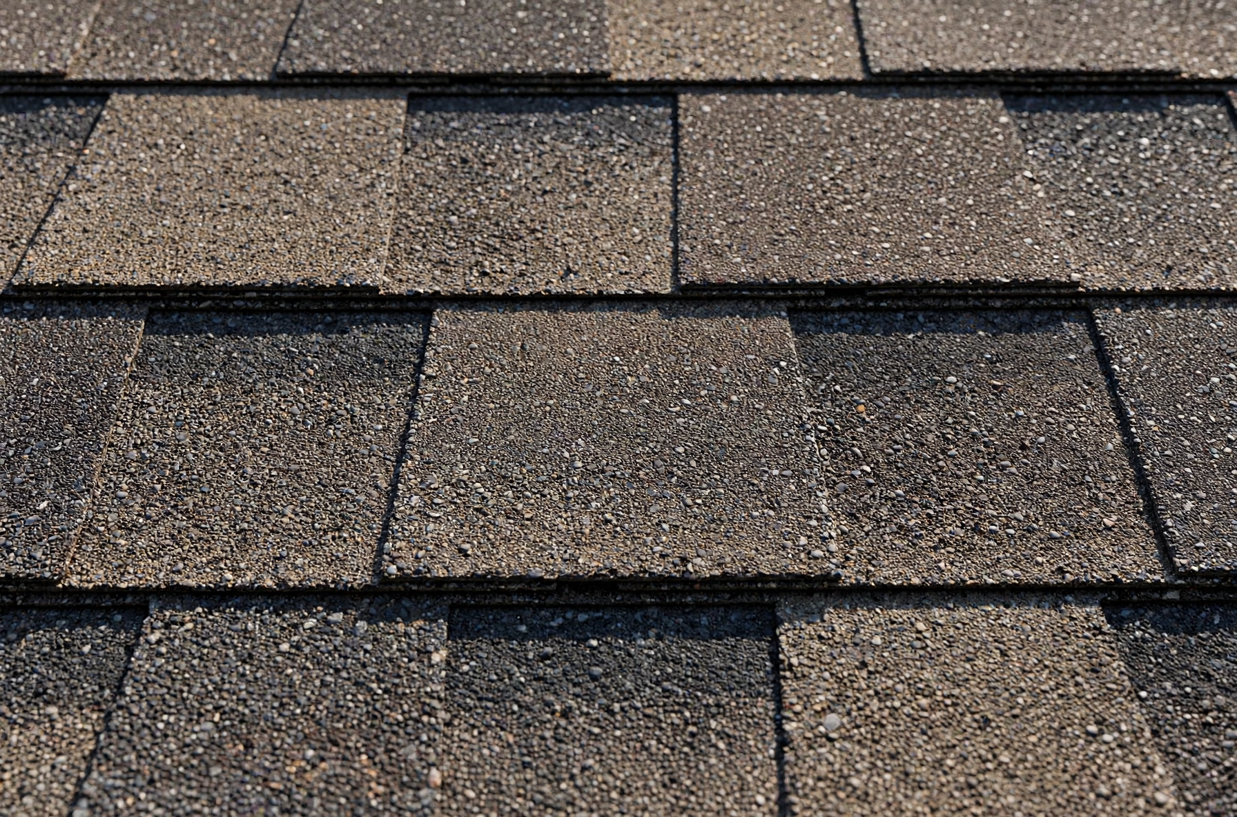Close-up of architectural asphalt shingles on an Owasso home