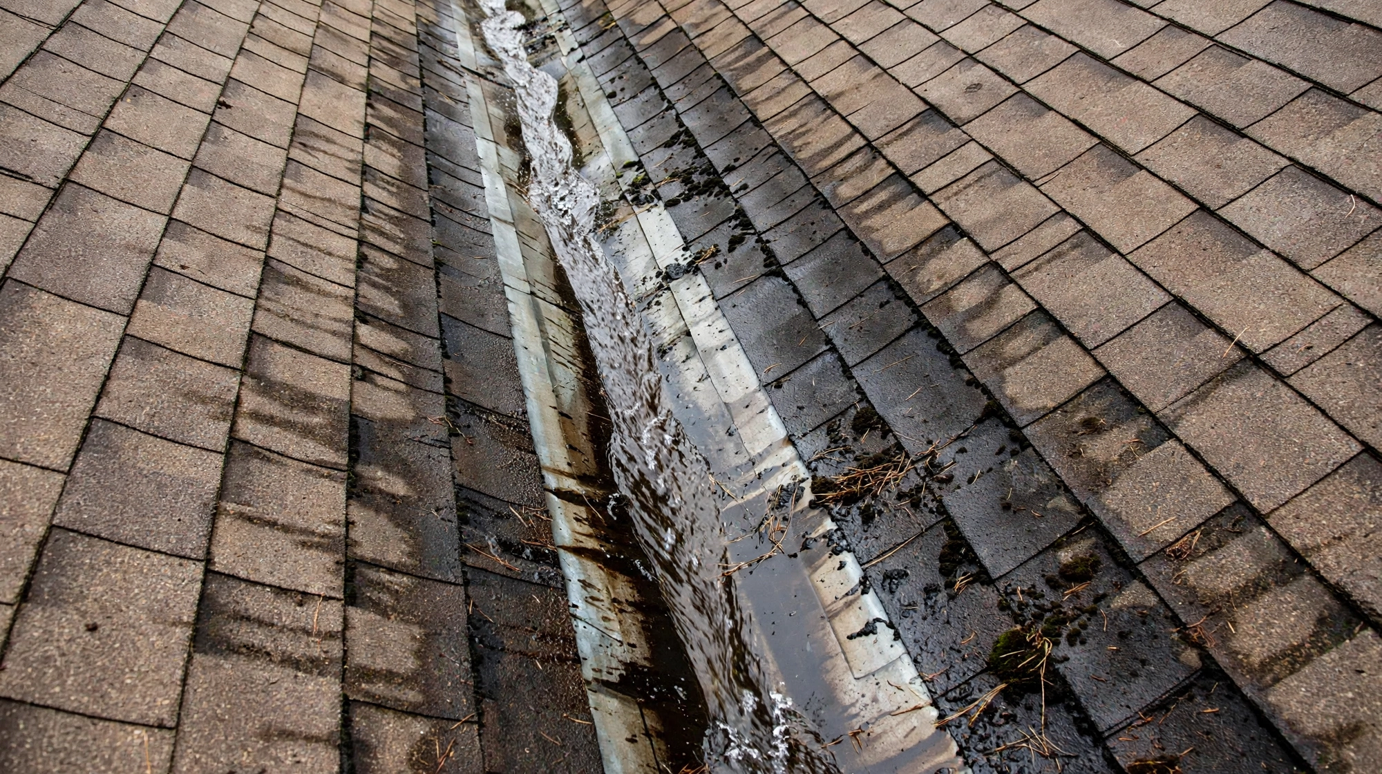 Roofer tracing a roof leak to failed flashing around a vent in Owasso