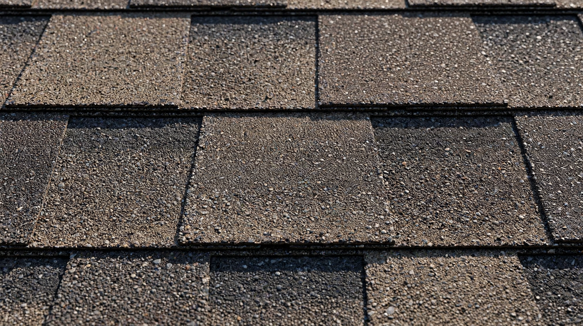 Architectural asphalt shingles being installed on an Owasso roof